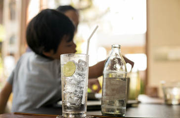 Healthy nutrition of drinking water with lemon and unidentified