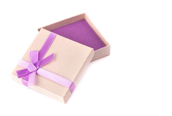 Gift box with purple ribbon bow, isolated on white