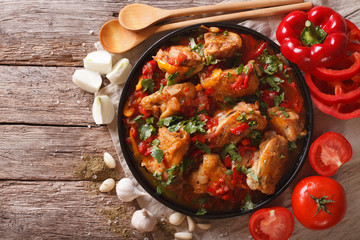 Chakhokhbili chicken stew with vegetables on the table. horizontal top view    © FomaA