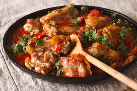 Chicken stew with vegetables and spices - chakhokhbili close-up. Horizontal
