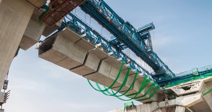 Timelapse at express way construction site while bridge girder erection machine working