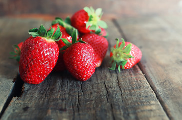 fresh strawberries on a wooden background