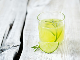 Fototapeta premium lime lemonade on wooden background