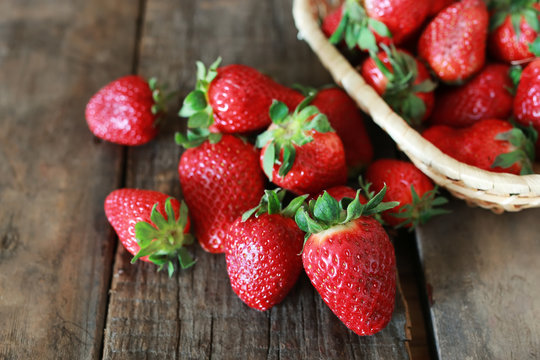 strawberries on a wooden background