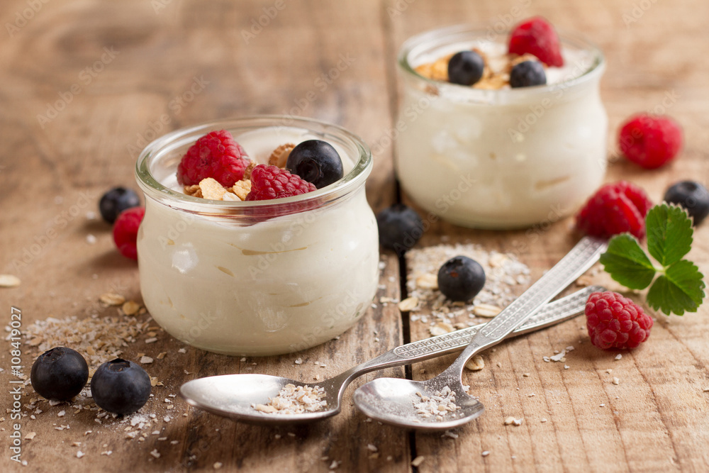 Wall mural Yogurt with granola or muesli and fresh berries