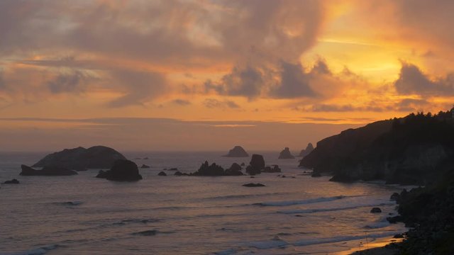 Locked down view of sunset at  Rainbow Rock, in the Natural Bridges area of the Samuel H. Boardman State Scenic Corridor, southern Oregon coast