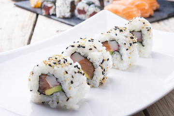 Salmon and caviar rolls served on a plate