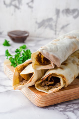 Lahmacun shape roll - turkish or arabian pizza with miced meat and spice