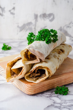 Lahmacun shape roll - turkish or arabian pizza with miced meat and spice