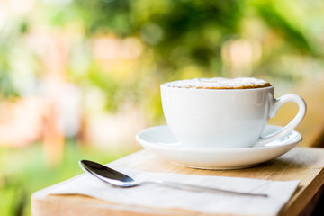 coffee cup on wooden table ,soft focus