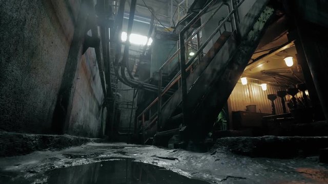 Abandoned industrial interior in dark colors with glowing lights