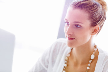 Attractive office worker sitting at desk