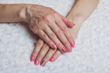 Pink nail art with flower on textile