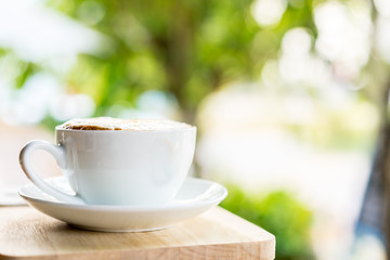 coffee cup on wooden table ,soft focus