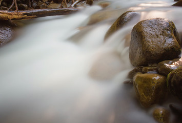 nice beautiful mountain stream with green stones