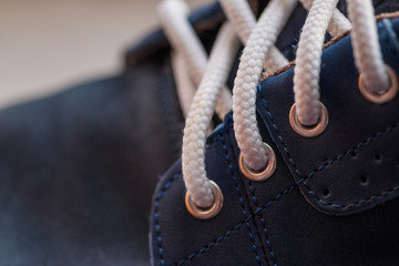 Leather (Nubuck) shoes, focus on details. Macro shot with shallo