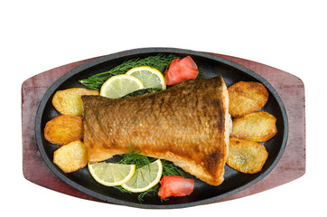 Fried fish in the pan, on a white background.