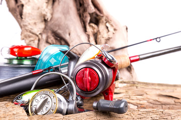 fishing tackles and fishing baits on wooden