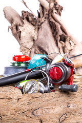 fishing tackles and fishing baits on wooden