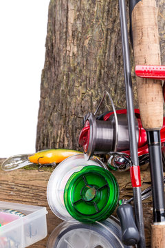 fishing tackles and fishing baits on wooden