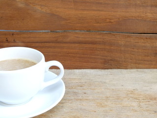cup of coffee on a wooden table background
