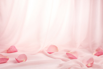 Rose petals on soft silk