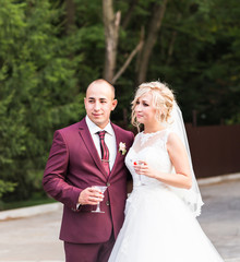 Bride and groom with glasses of champagne