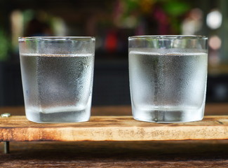 glasses of water on a wooden table