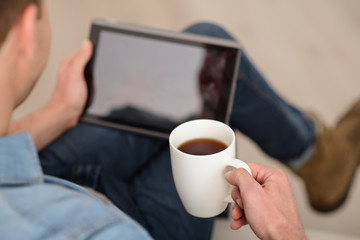 Pleasant man drinking coffee