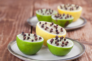 Lemon and limes with cloves, natural insect repellent