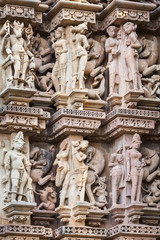 Fototapeta na wymiar Cultural heritage of India the sculptures made of sandstone, Kandariya Mahadeva, Khajuraho, Madhya Pradesh.