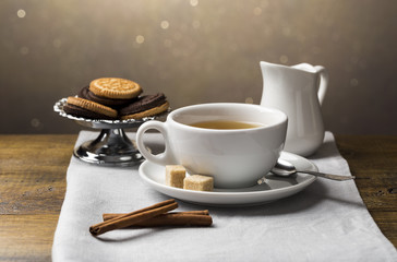 Set of tea cups with saucer and milk jug