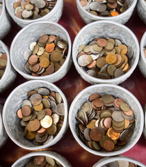 Coin in the donation bowl