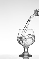 Pouring water in to glass