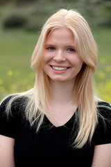 Naklejka premium Happy blonde girl outside
