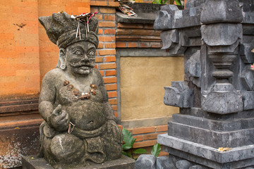 Traditional guard statue carved in stone on Bali, Indonesia.