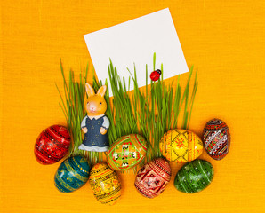 Blank, greeting easter card with easter eggs, bunny and green grass