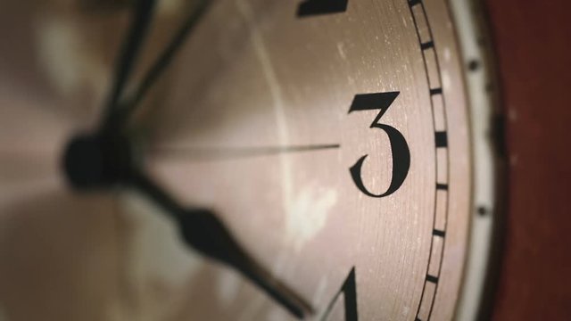 Close up of a wall clock face.