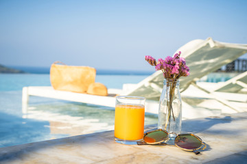 relax time at the pool with orange juice