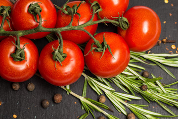 branch of cherry ripe tomatoes, fresh rosemary, allspice, food photography