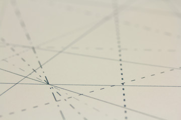 Black pins in paper linked by lines