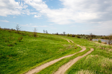 rut road across green slope
