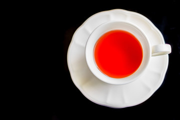 Cherry tea on table, soft focus