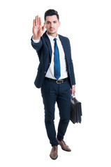 Handsome sales man showing stop gesture