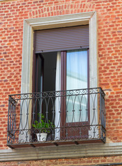 Fototapeta na wymiar window railing brick facade