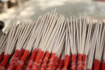 incense or joss sticks blurred for background.