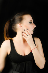 Portrait of beautiful young brunette woman in ear-rings 