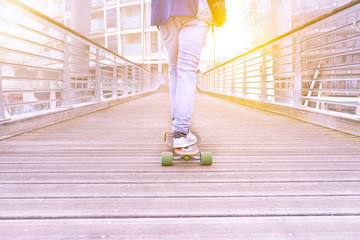 Closeup of young woman on skateboard