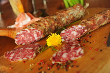 Homemade Italian salami on the wooden board