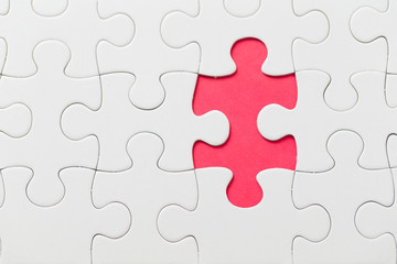 Obraz premium Puzzle with missing piece in red color